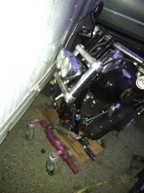 disassembled motorcycle in storage