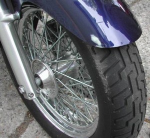 paint scuff showing contact with the motorcycle and a car