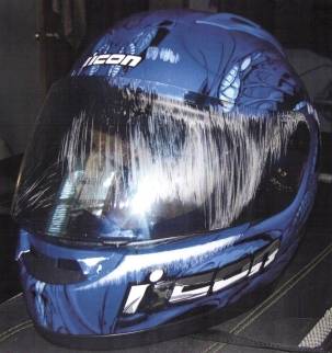 motorcycle helmet with visor scraped