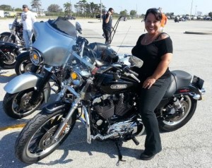 Photo of friend Donna sitting on her Harley Davidson motorcycle