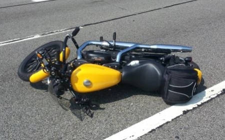 Motorcycle layed down on road