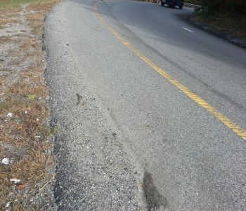 Sand and gravel alleged to have caused the motorcycle accident